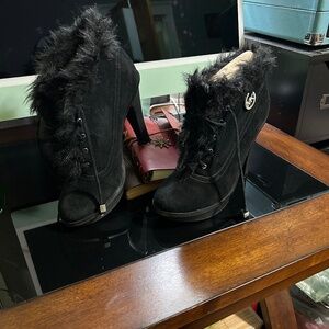 Michael Kors high heel ankle boot with faux-fur trim.